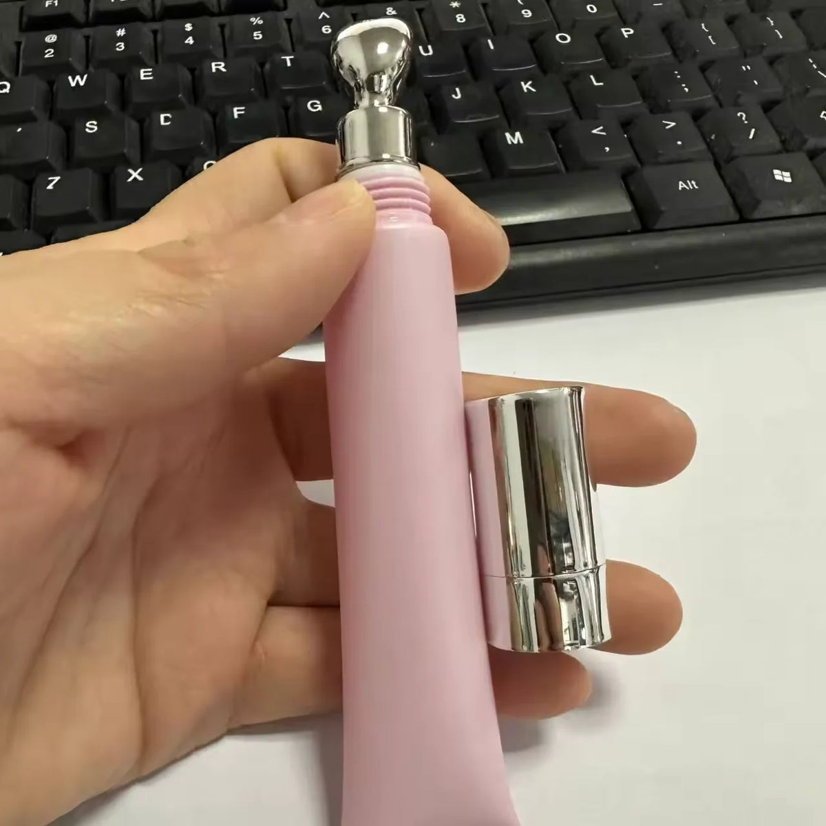Empty squeeze tube with metal massage head