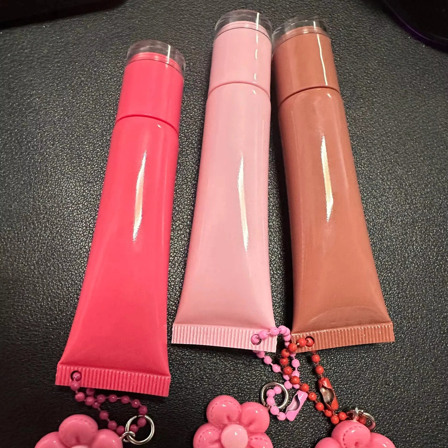Empty plastic squeeze lip balm tubes