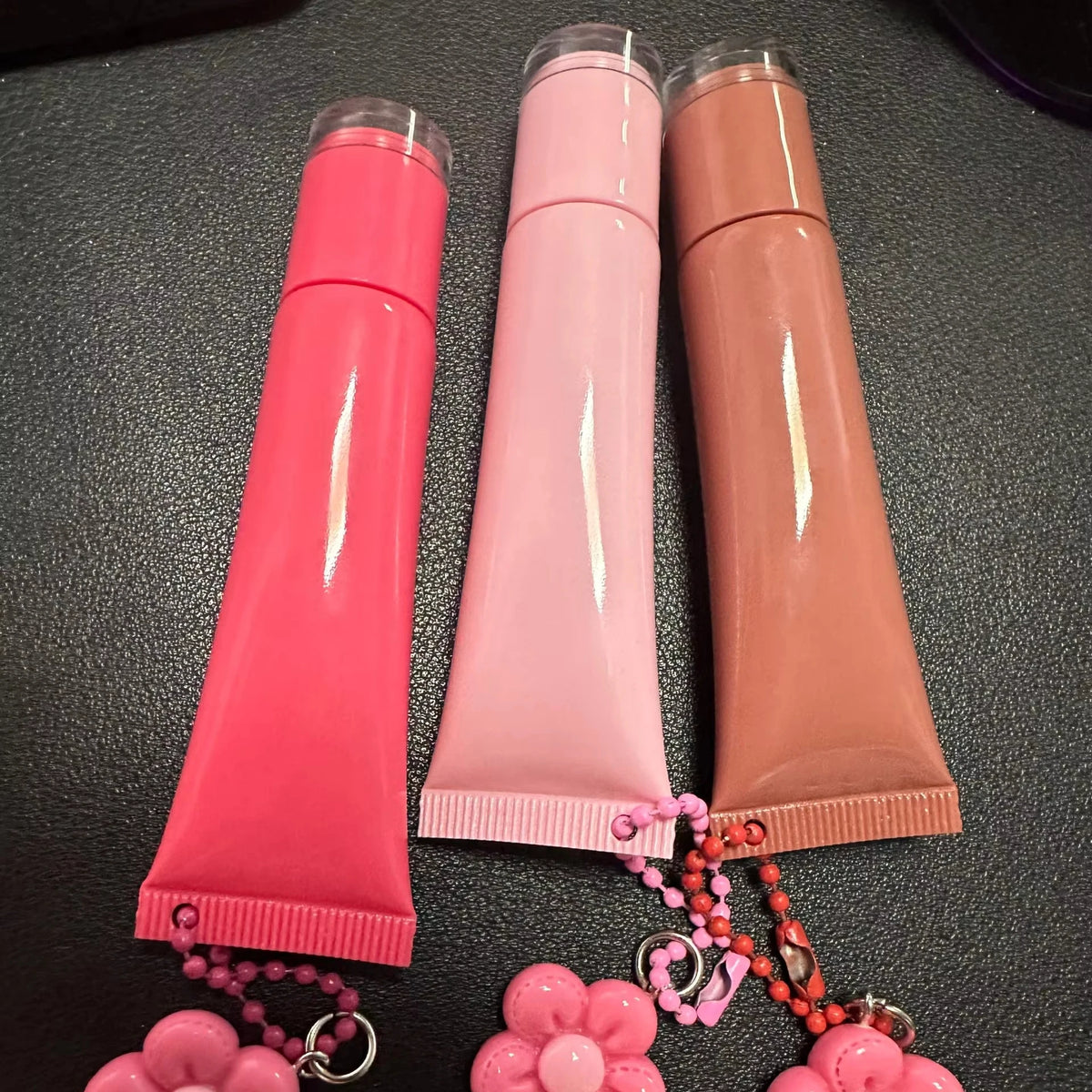 Empty plastic squeeze lip balm tubes