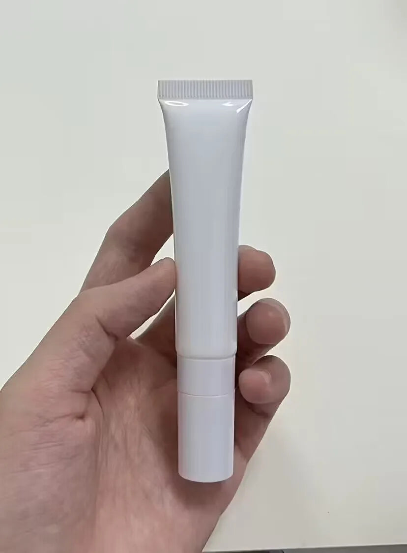 Empty squeeze tube with metal massage head