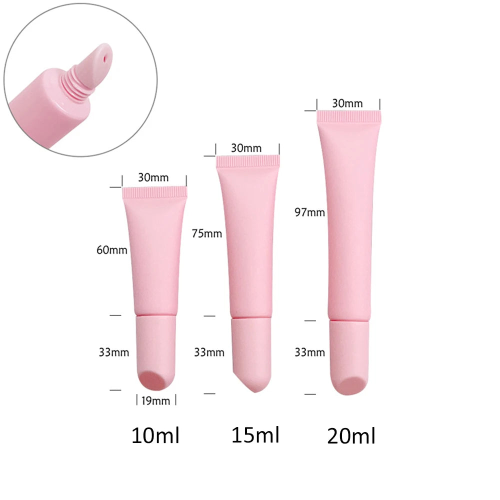Empty matte plastic squeeze lip balm tubes in white and pink