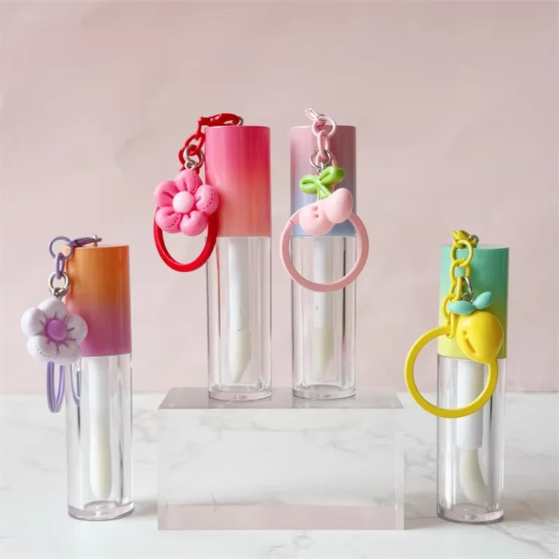 hot selling multi-color lid round tube cosmetics container plastic cute empty lip oil lipstick tube with keychain