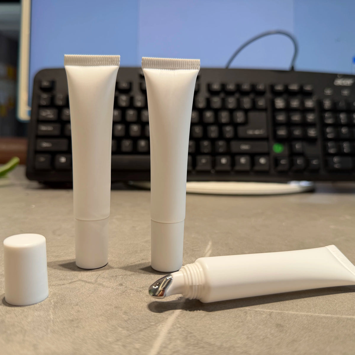 Empty plastic squeeze cosmetic tube