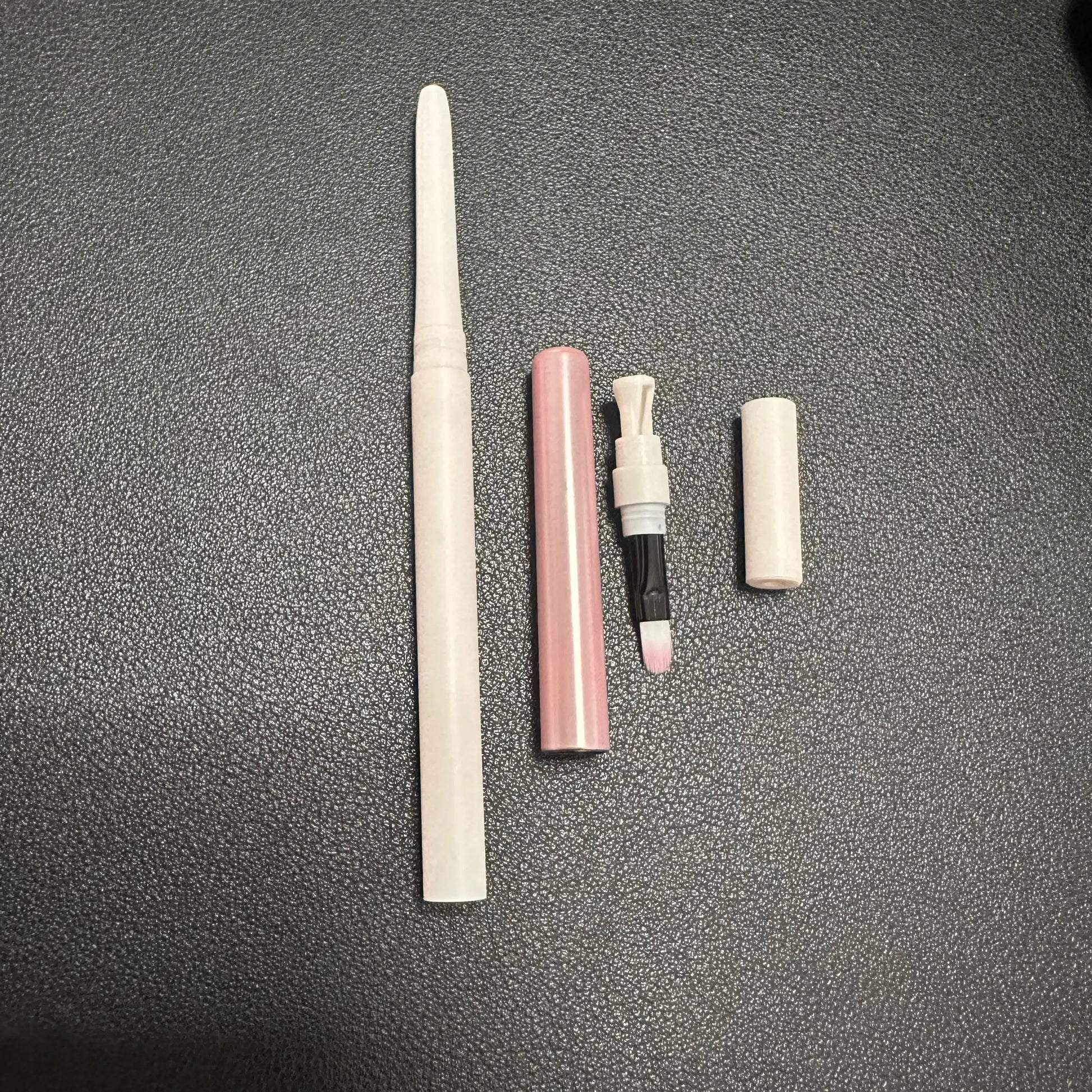 Retractable lip liner with sharpener