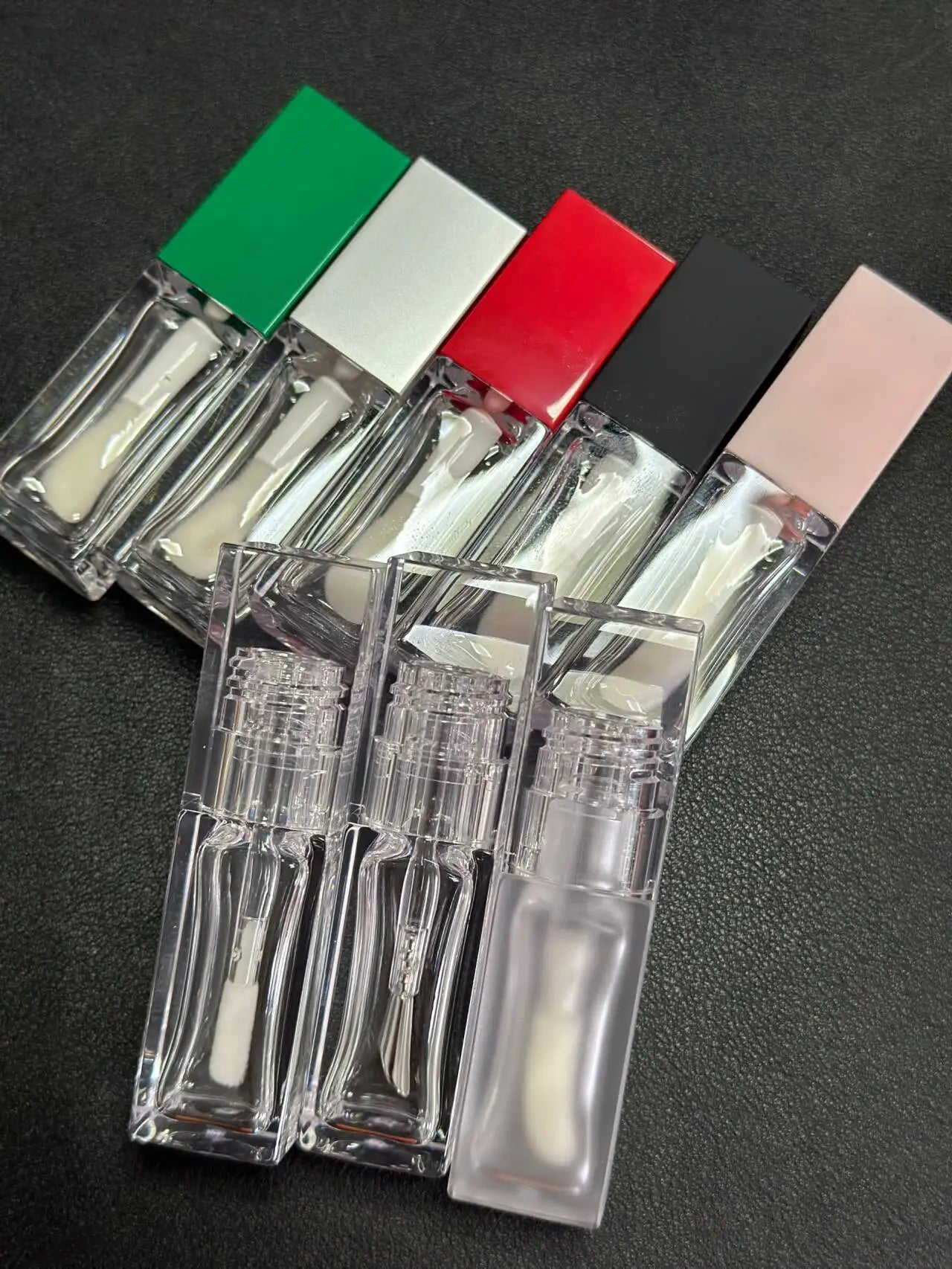 Empty clear square lip gloss container with big doe foot applicator