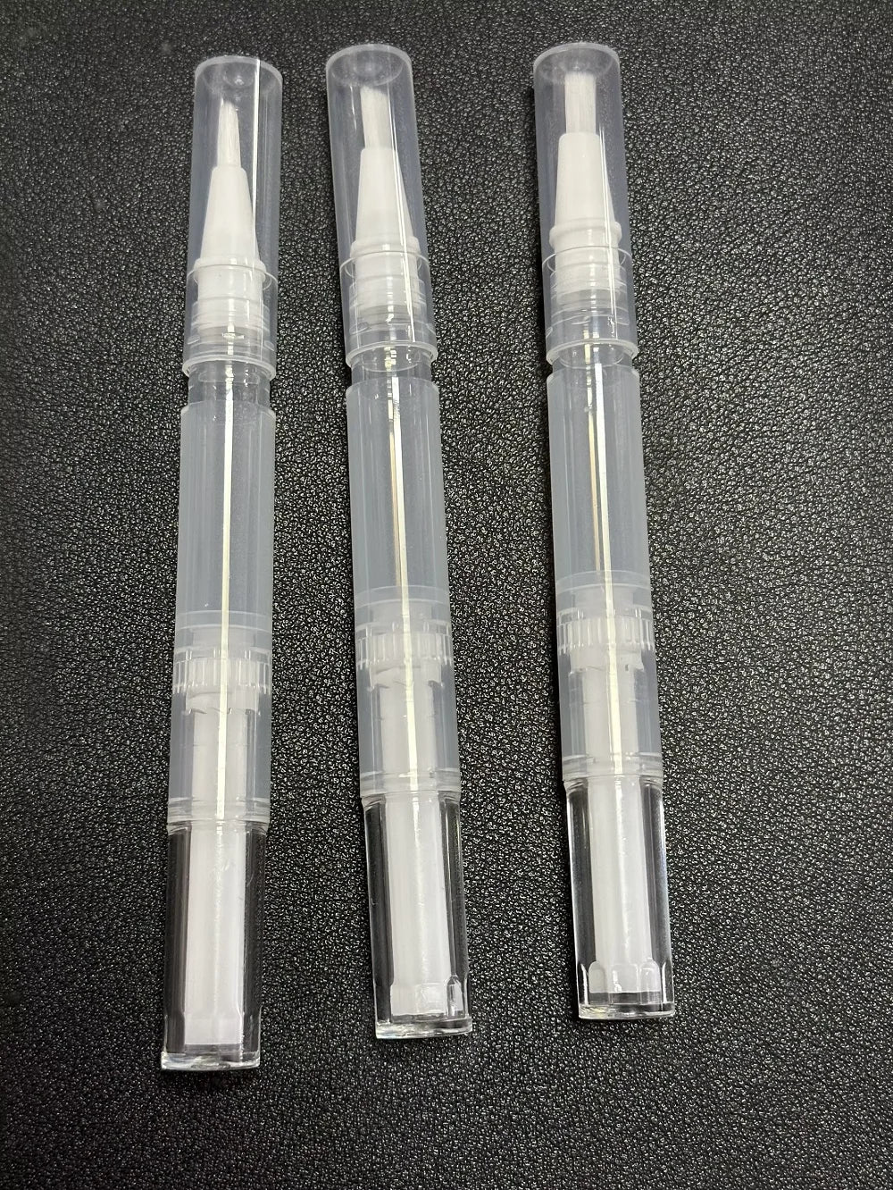 Empty cuticle oil twist pen with brush for nail and lip care
