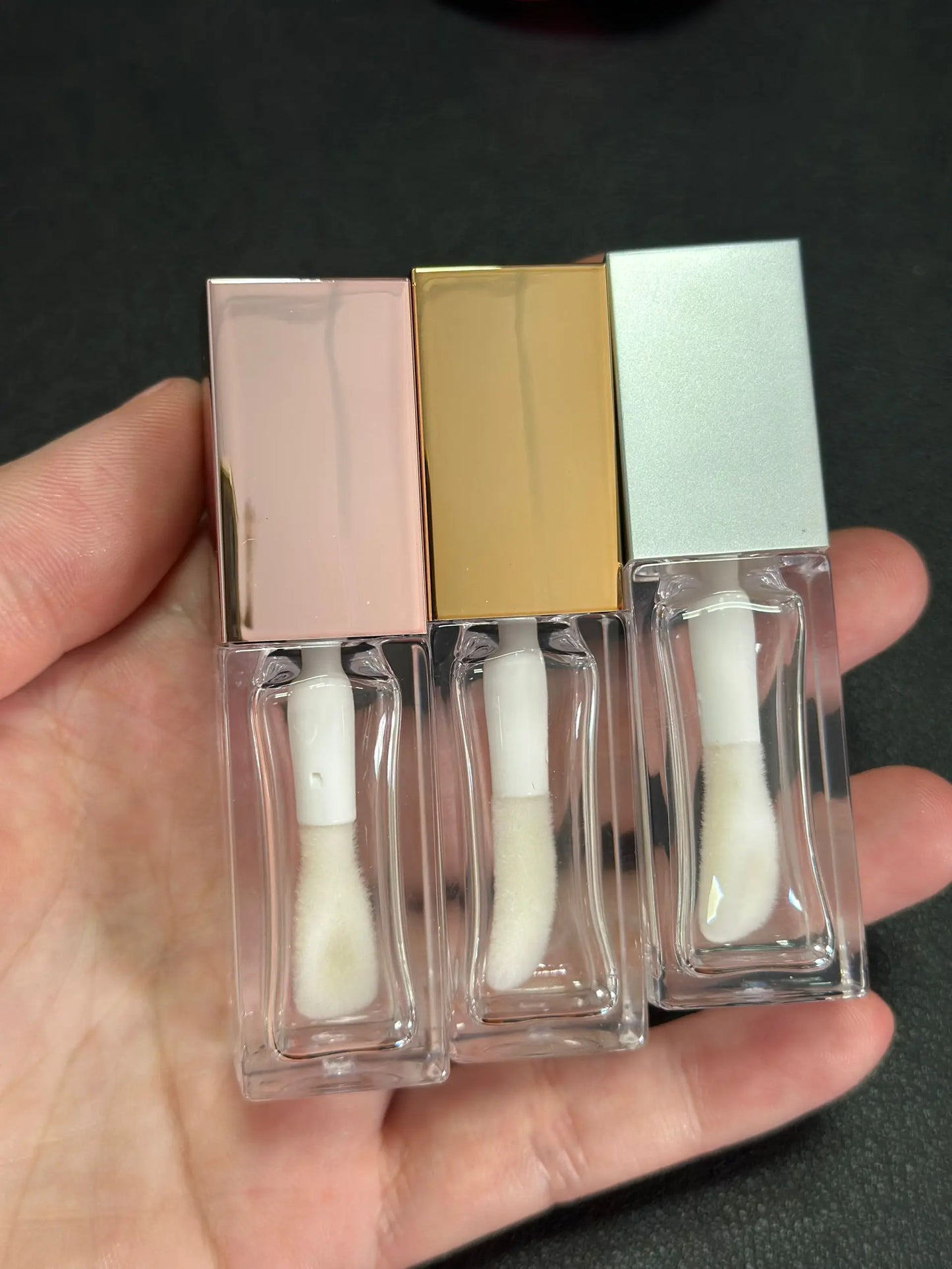 Empty clear square lip gloss container with big doe foot applicator
