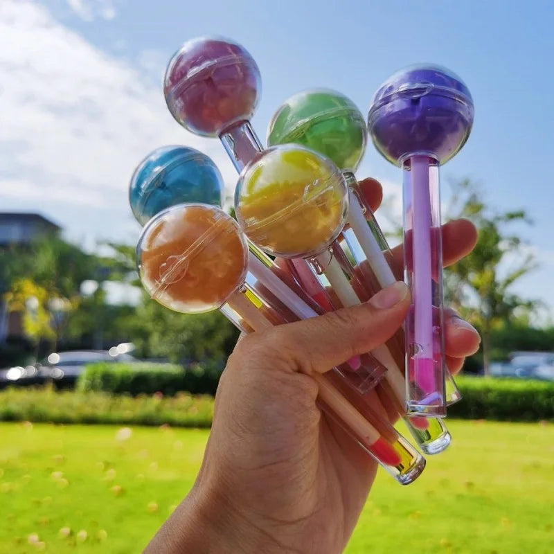 lip care products magic color hydrating tinted clear color changing lip oil 2-in-1 pink lollipop round ball chapstick li