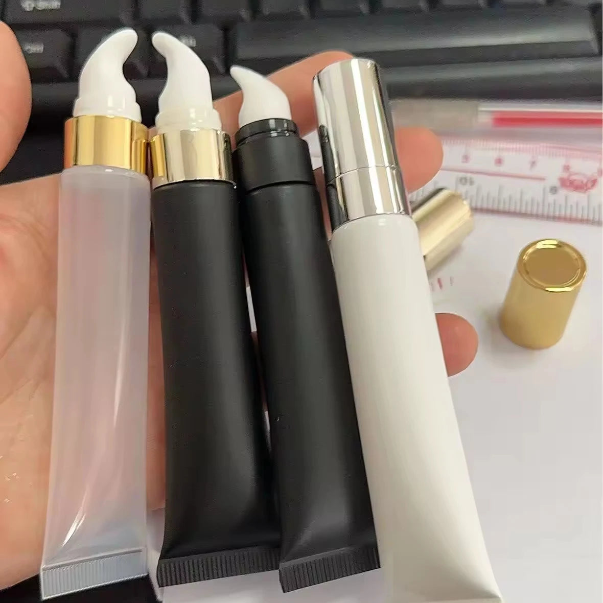 Empty squeeze tube with metal massage head