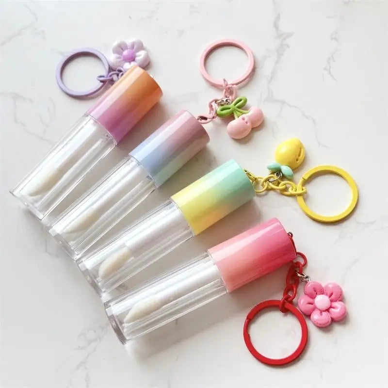 hot selling multi-color lid round tube cosmetics container plastic cute empty lip oil lipstick tube with keychain