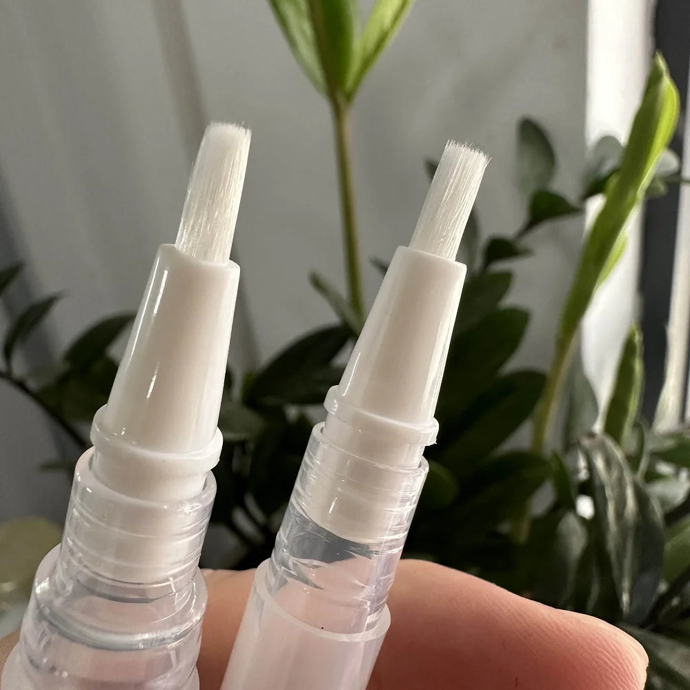 Empty cuticle oil twist pen with brush for nail and lip care
