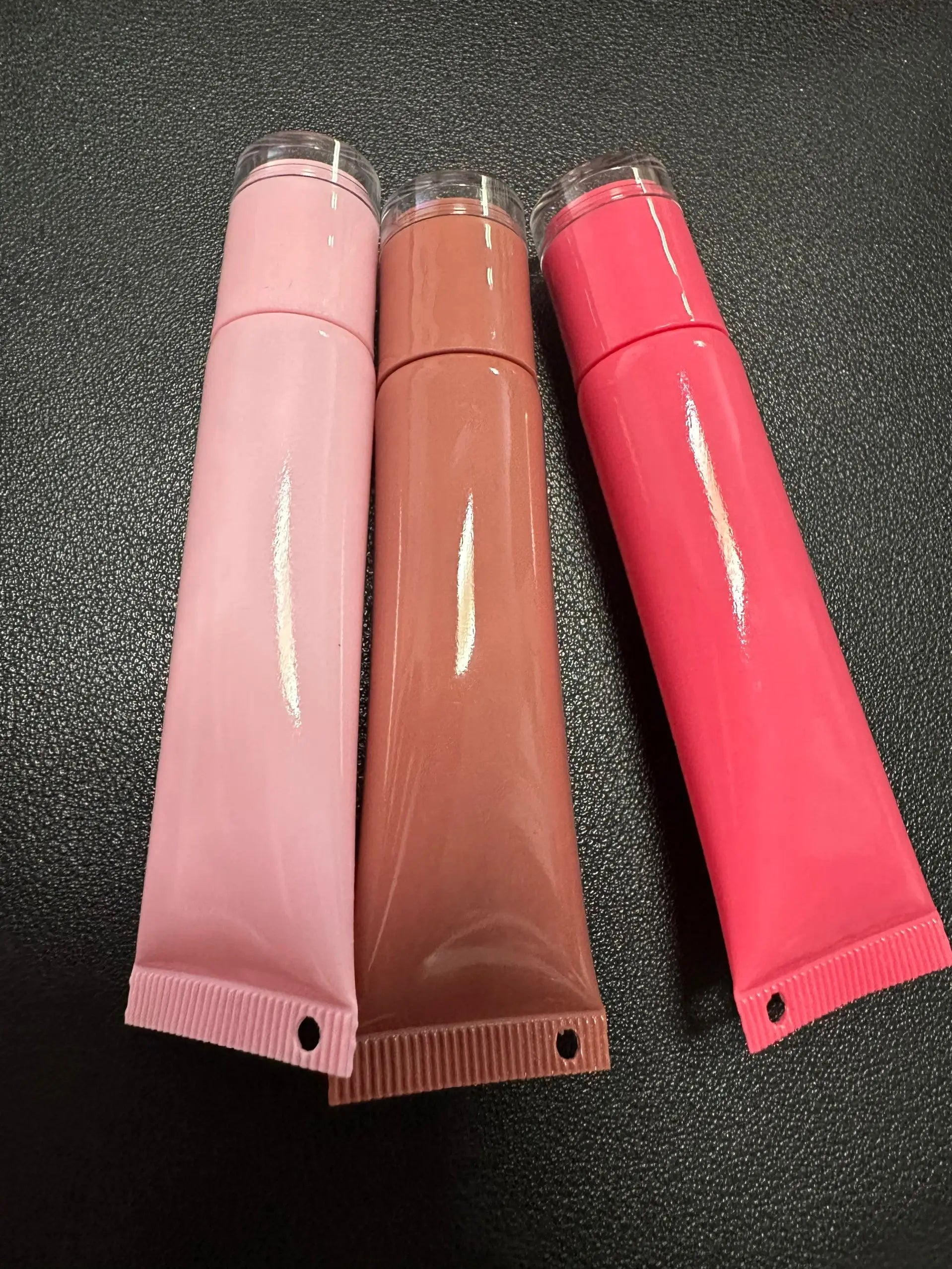 Empty plastic squeeze lip balm tubes