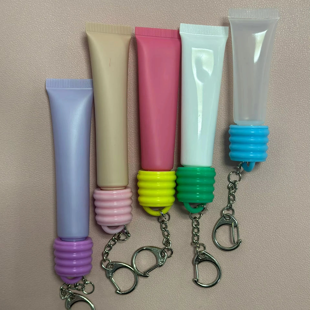 Skin Care Products Keychain Holder Customized Lip Balm Silicone Mini Keychain Cap for Lipgloss Lip Oil  Squeeze Soft Tubes